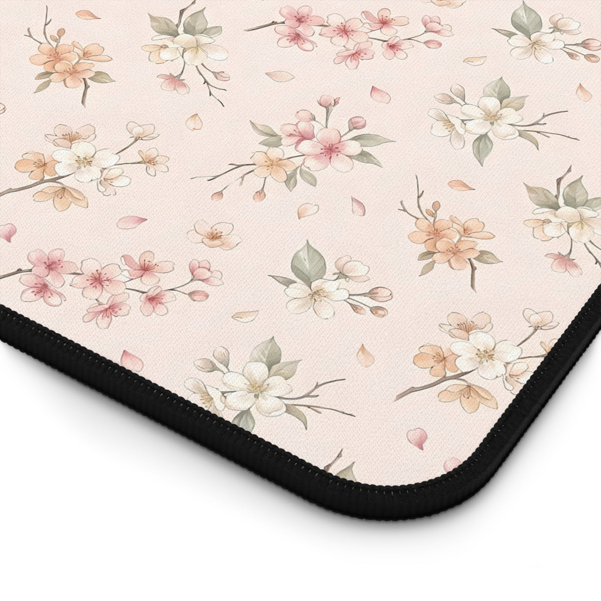 Blush pink blossom print desk mat with hemmed edges