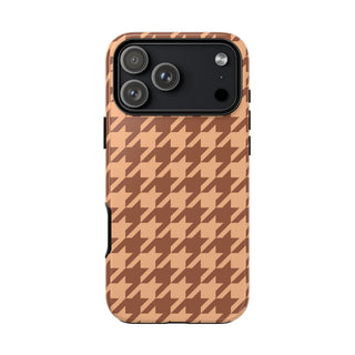Brown houndstooth tough phone case on peachy tan