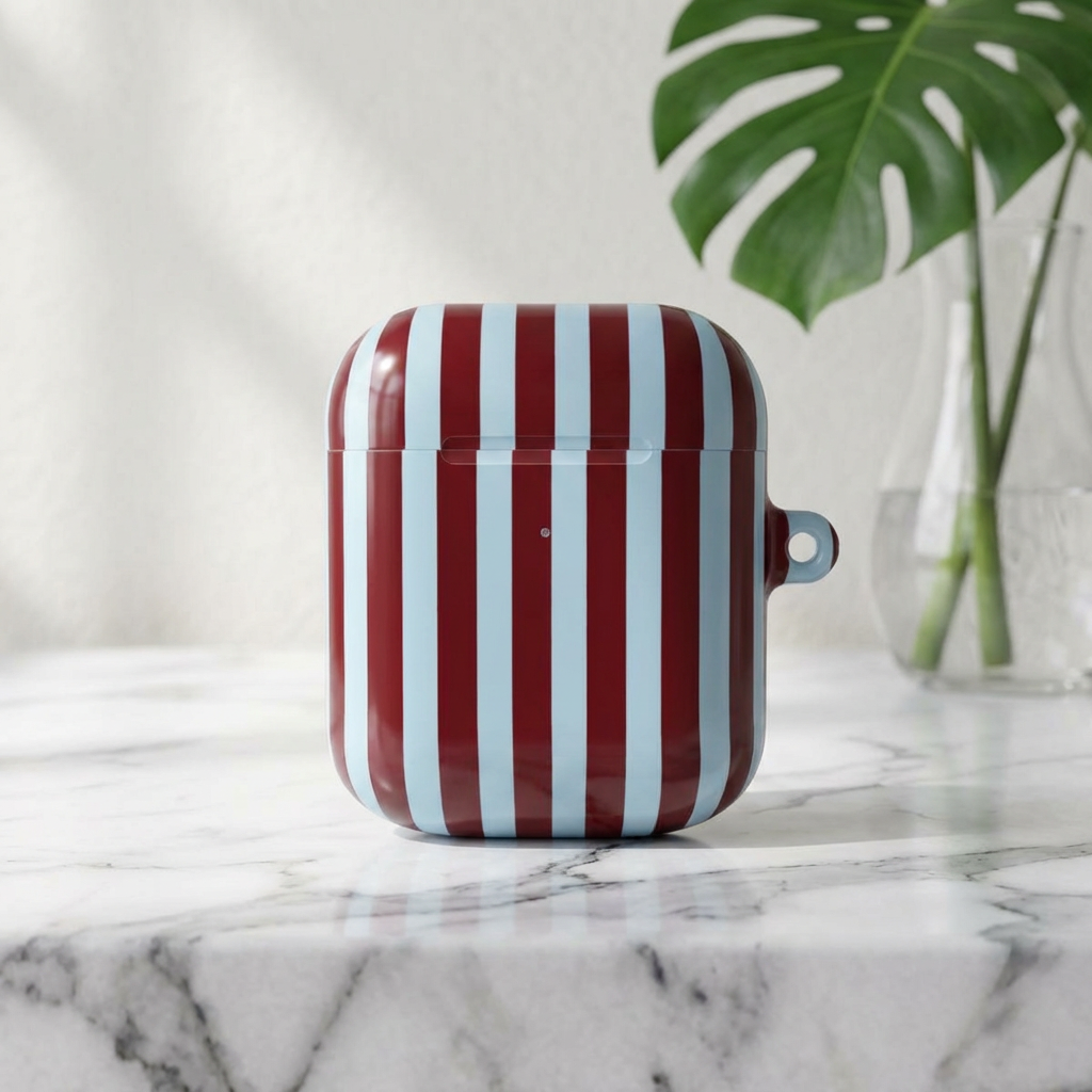 Burgundy and light blue stripe pattern detail on an AirPod case