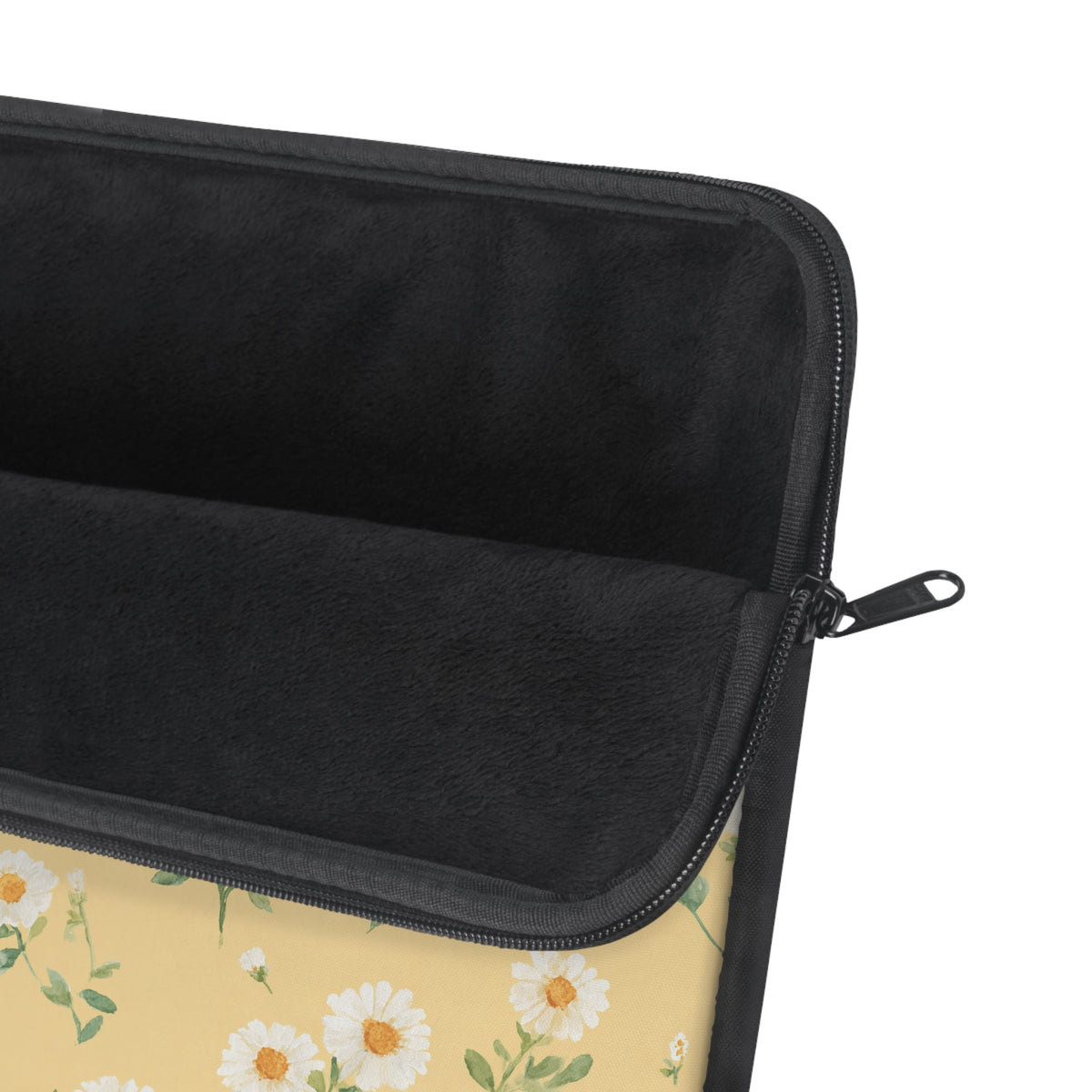 Daisy print laptop sleeve with a laptop sliding in