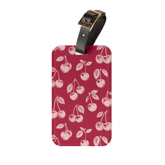 Red cherry luggage tag with black leather strap