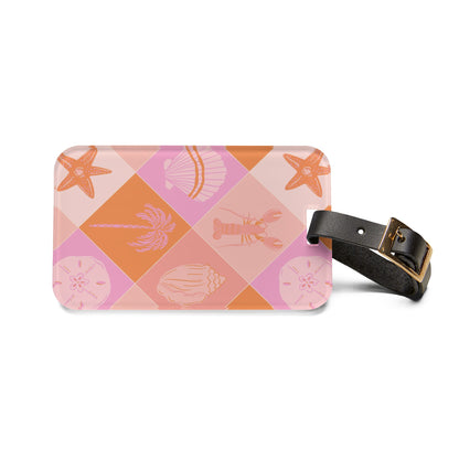 Pink checkerboard luggage tag with starfish and shell motifs