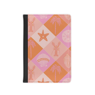 Pink coastal check passport cover with lobster and shell motifs
