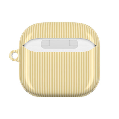 Monogrammed butter yellow striped AirPod case on a neutral background