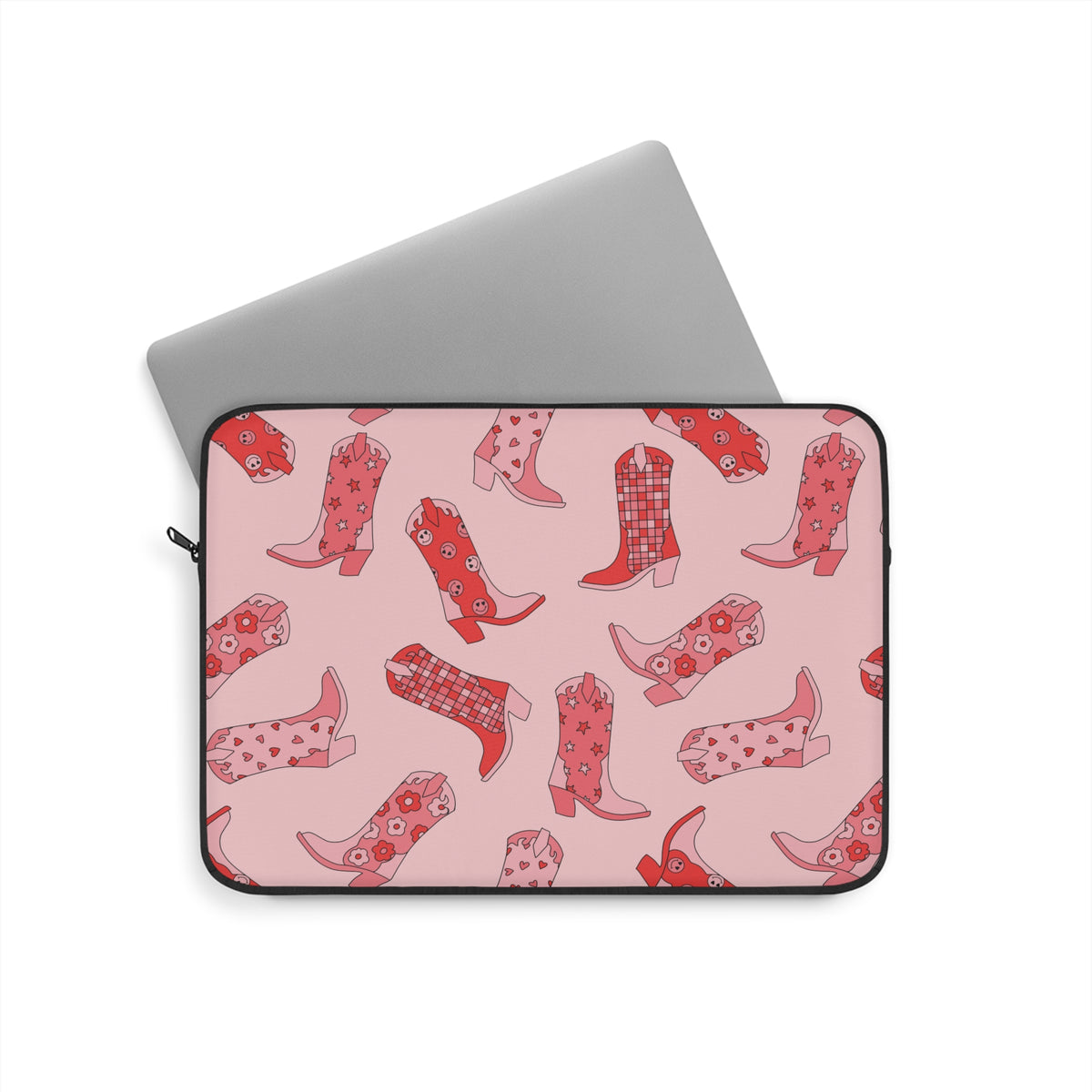 Laptop sliding into the cowboy boot print laptop sleeve