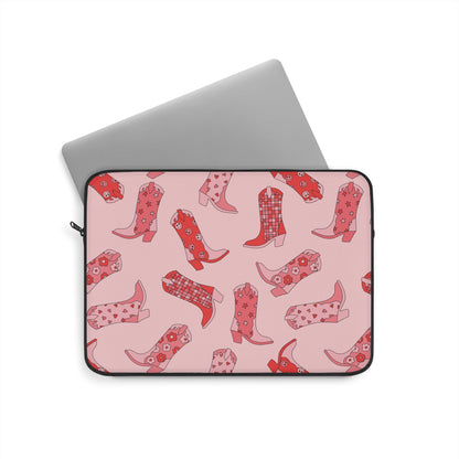 Laptop sliding into the cowboy boot print laptop sleeve