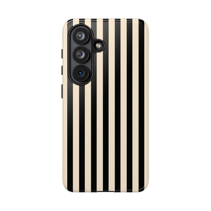 Black and cream striped tough phone case held in hand