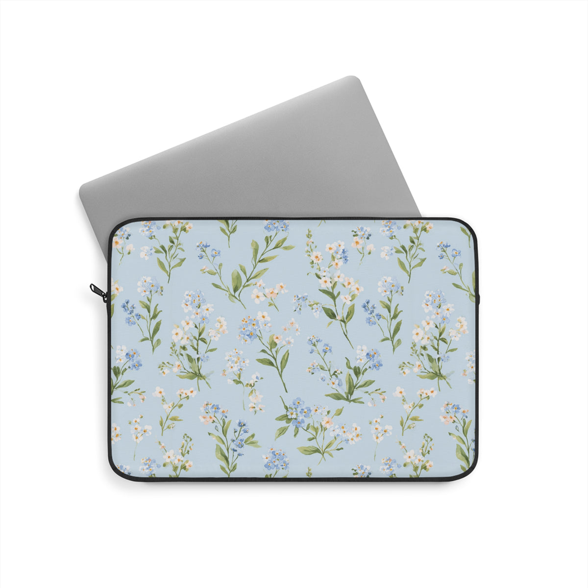 Blue floral laptop sleeve with white daisies on light blue