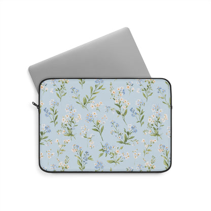 Blue floral laptop sleeve with white daisies on light blue