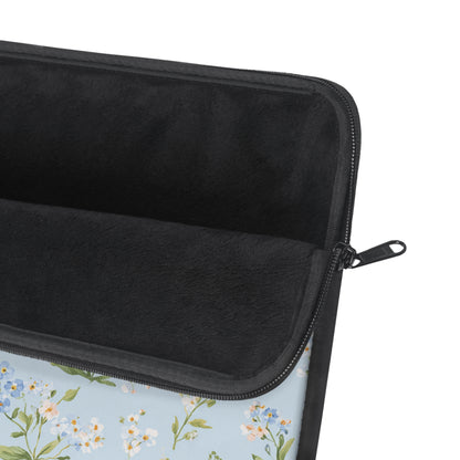 Close-up of the blue meadow floral print on the laptop sleeve