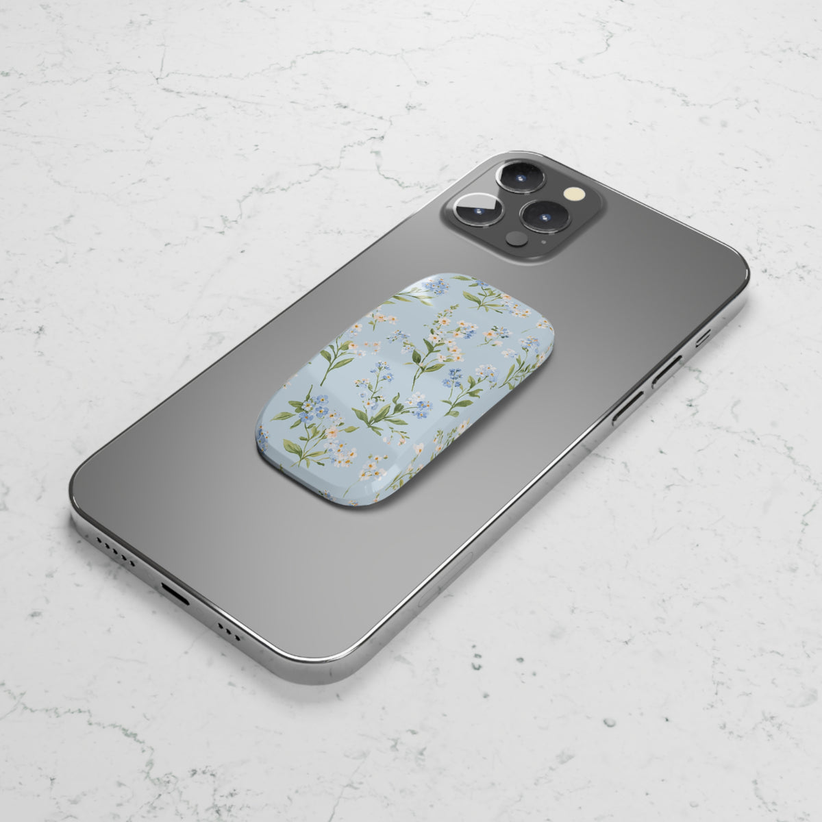 Blue meadow floral phone grip used as a kickstand