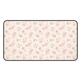 Blush floral desk mat with a scattered blossom print