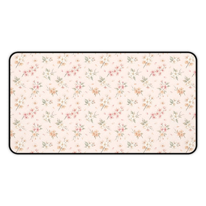 Blush floral desk mat with a scattered blossom print