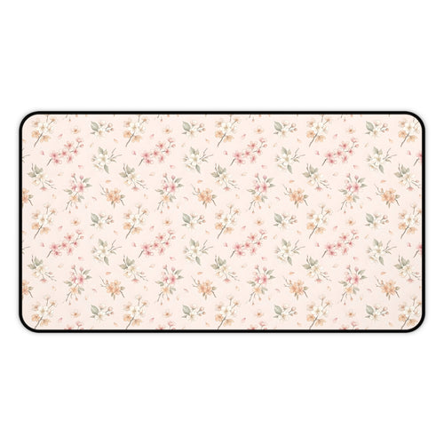 Blush floral desk mat with a scattered blossom print