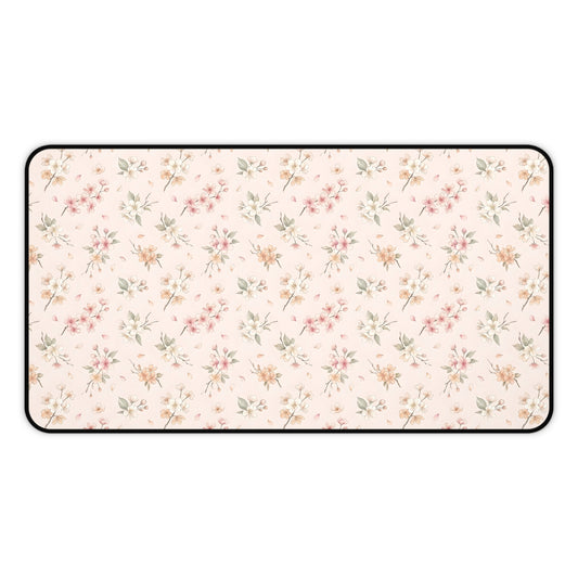 Blush floral desk mat with a scattered blossom print