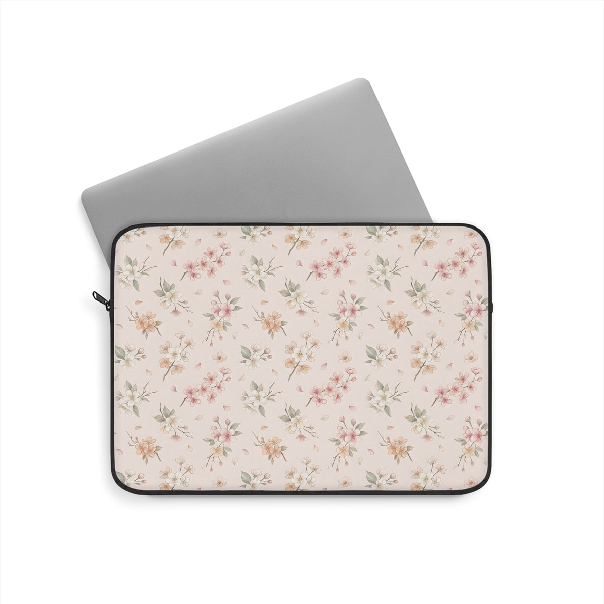 Floral laptop sleeve in blush pink with a black zipper