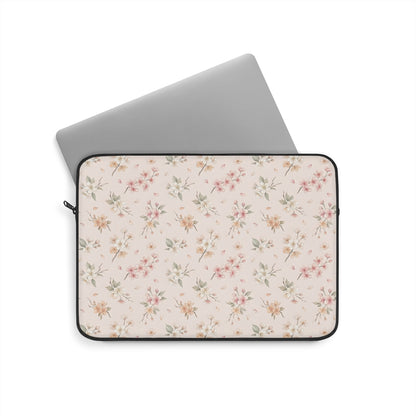Floral laptop sleeve in blush pink with a black zipper
