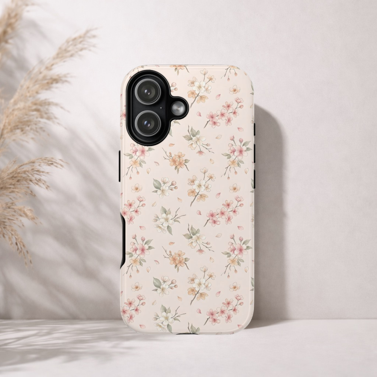 Tough phone case in blush pink with a scattered blossom print