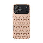 Brown bow tough phone case with tiny hearts on peach pink