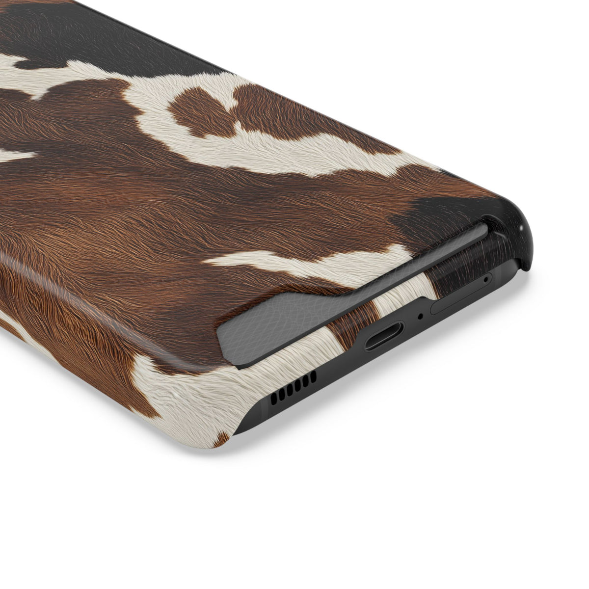 Brown cow print phone case with card holder, angled view