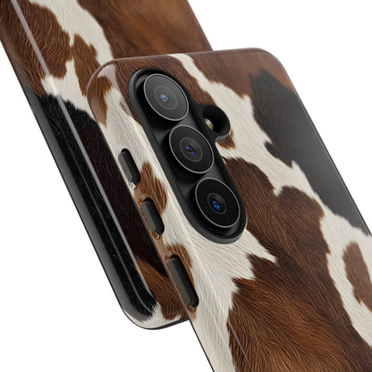 Brown cow print tough phone case, angled view