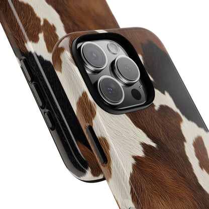 Brown cow print tough phone case, lifestyle view