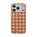 Brown houndstooth phone case with card holder on peachy tan