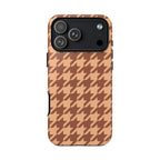 Brown houndstooth tough phone case on peachy tan