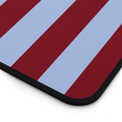 Burgundy blue striped desk mat on a home office desk