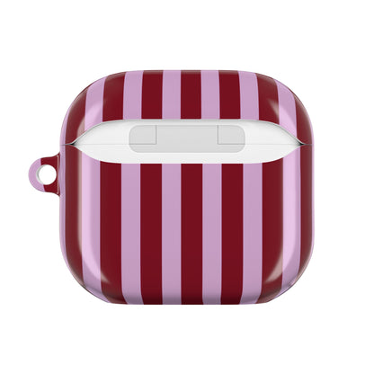 Striped AirPod case held in hand