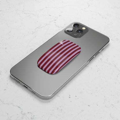 Burgundy pink striped phone grip used as a kickstand