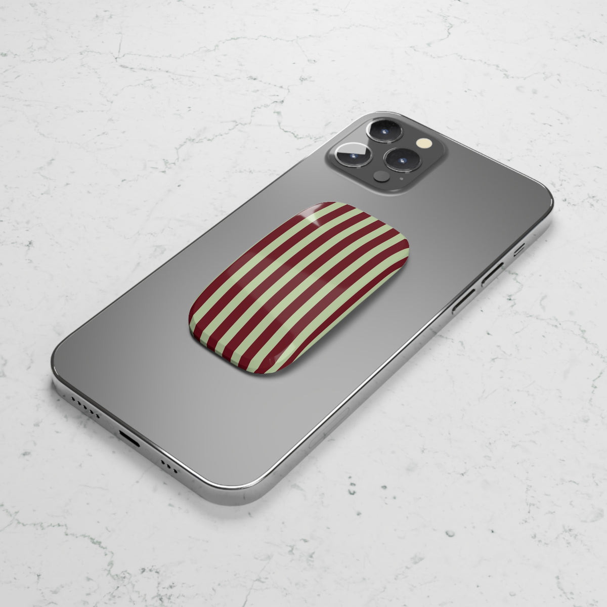 Burgundy sage striped phone grip used as a kickstand