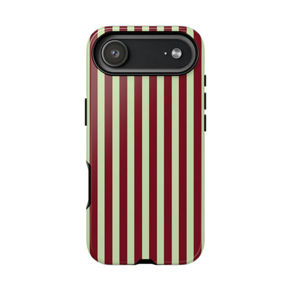 Burgundy sage striped tough phone case held in hand