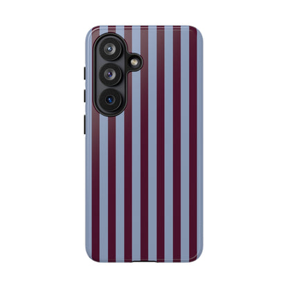 Burgundy and slate blue striped tough phone case held in hand