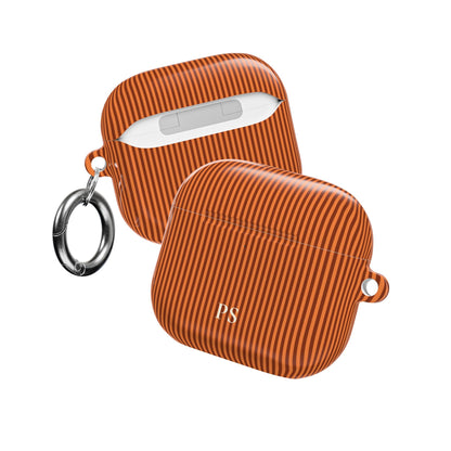 Personalized burnt orange striped AirPod case shown from the side