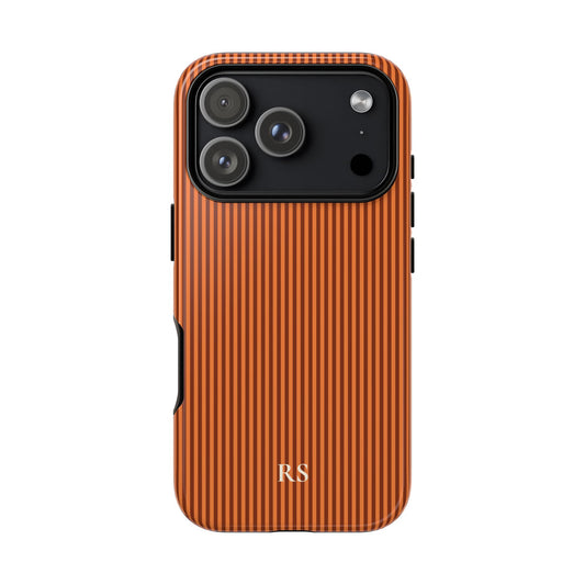 Personalized burnt orange striped tough phone case with cream monogram