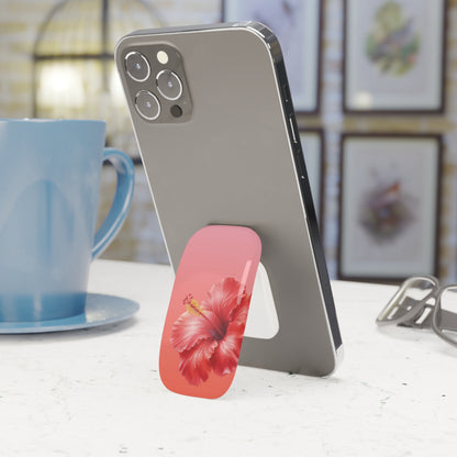 Hibiscus phone grip in coral and pink on the back of a phone