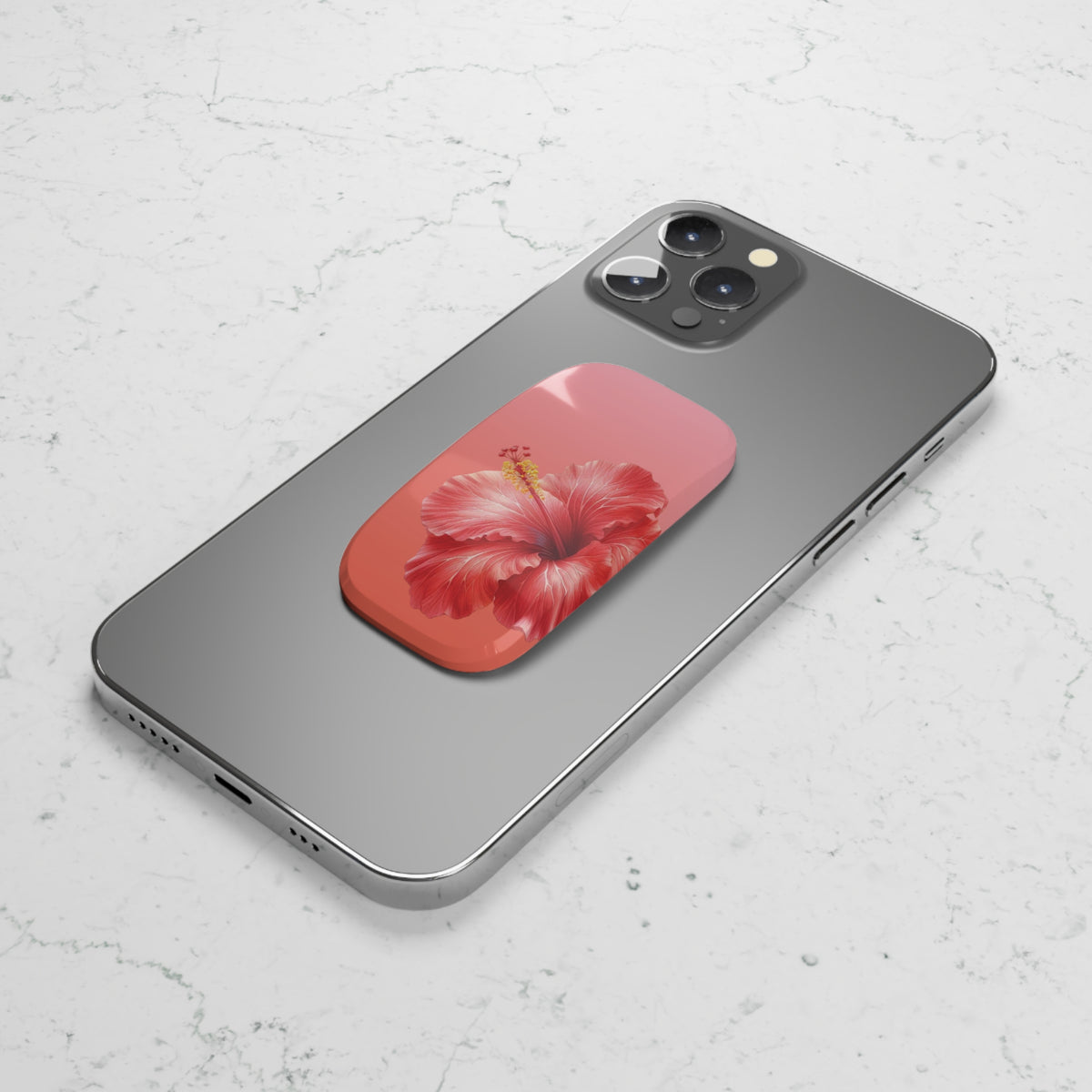 Coral hibiscus phone grip used as a kickstand