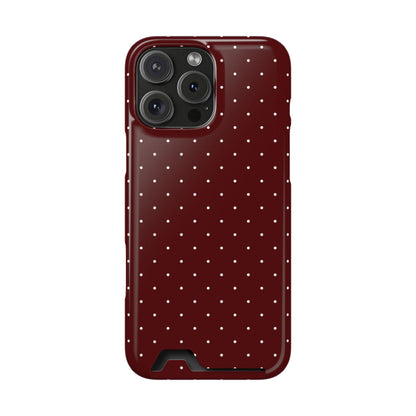Dark red polka dot phone case with a card in the slot