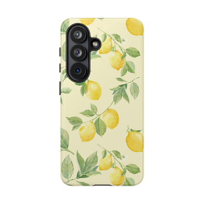Yellow lemon tough phone case with green leaves and small white blossoms