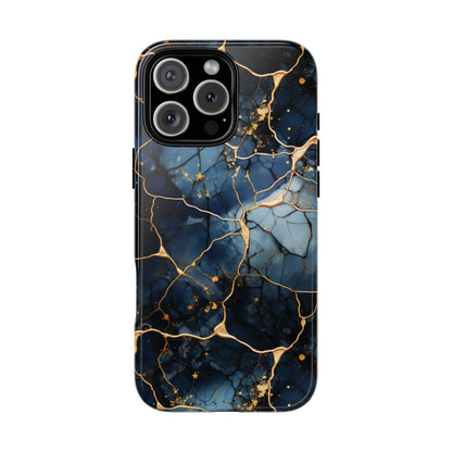 Navy marble print tough phone case with ochre-toned veining on a flat surface