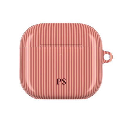 Personalized coral AirPod case held in hand