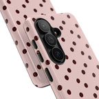 Pink and brown polka dot tough phone case, angled view
