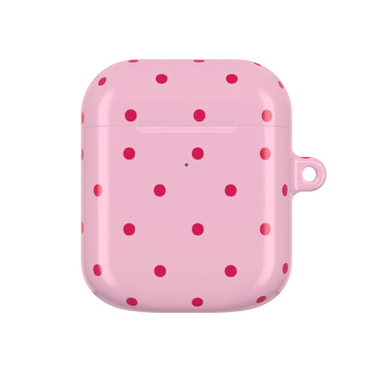 Pink AirPod case with red polka dots and carabiner clip