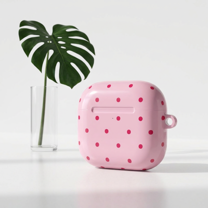 Red dots on dusty pink, print for an AirPod case