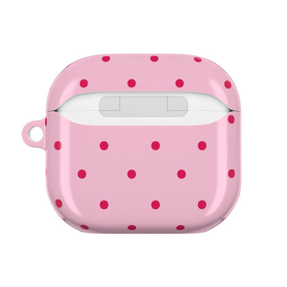 Pink and red polka dot AirPod case with the lid open