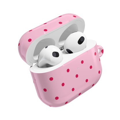 Pink AirPod case with an even grid of red dots