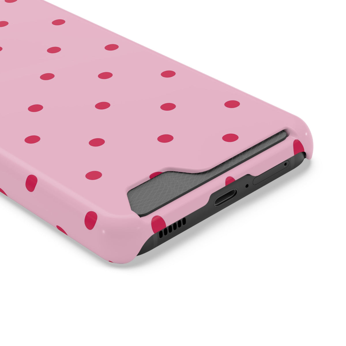 Raspberry red dots on a dusty pink phone case, back view
