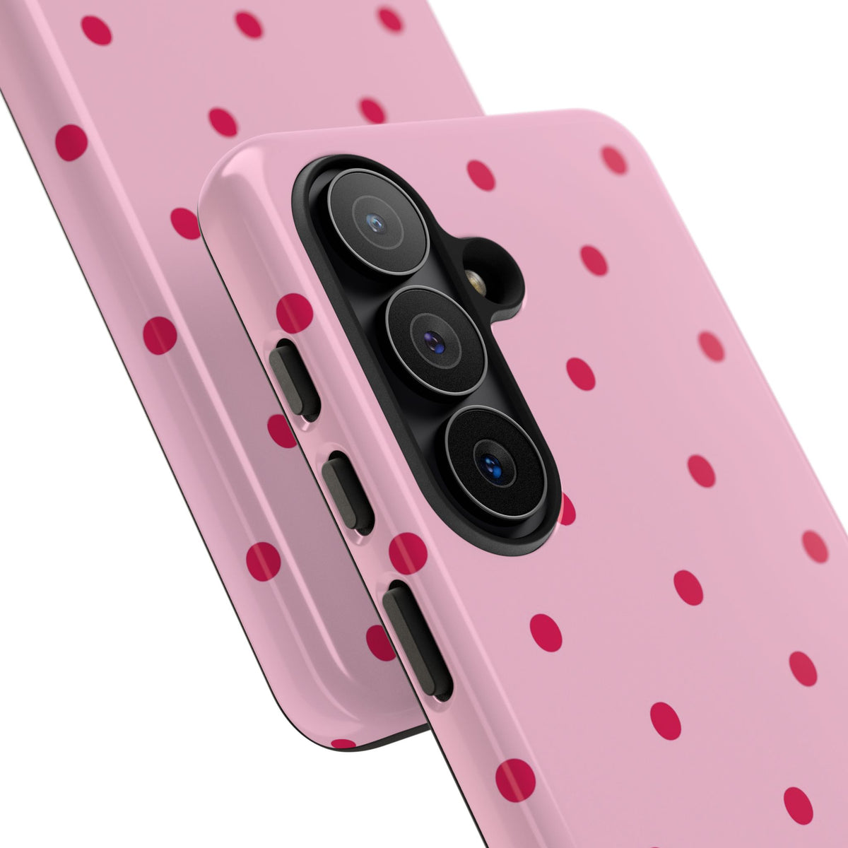Pink tough phone case with raised camera edge and red dots