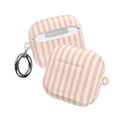 Striped AirPod case clipped to a bag strap